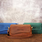 Close-up of leather crossbody pouch magnetic closure detail