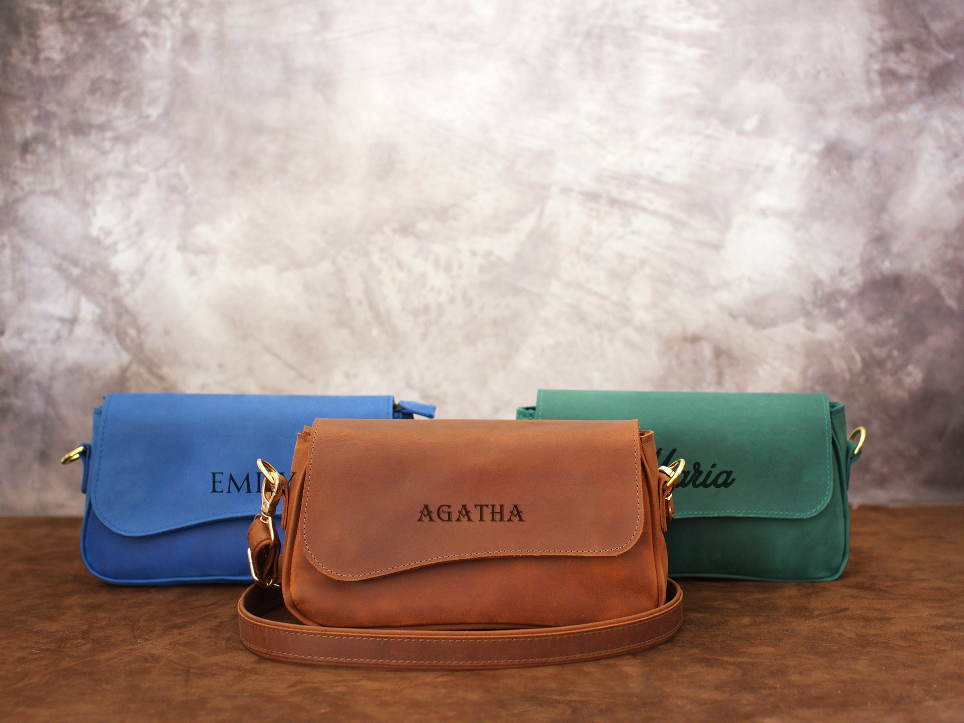 Close-up of leather crossbody pouch magnetic closure detail