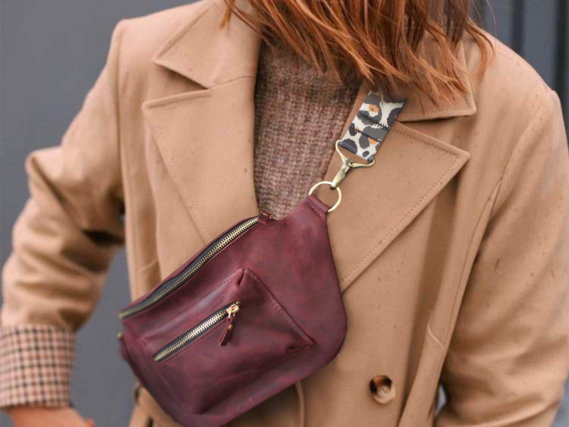 Person wearing a beige coat with a purple leather bag over their shoulder.