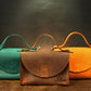 Premium leather structured handbag with name stamp, warm earthy tone