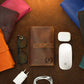 Close-up of leather cord organizer zipper and hardware detail
