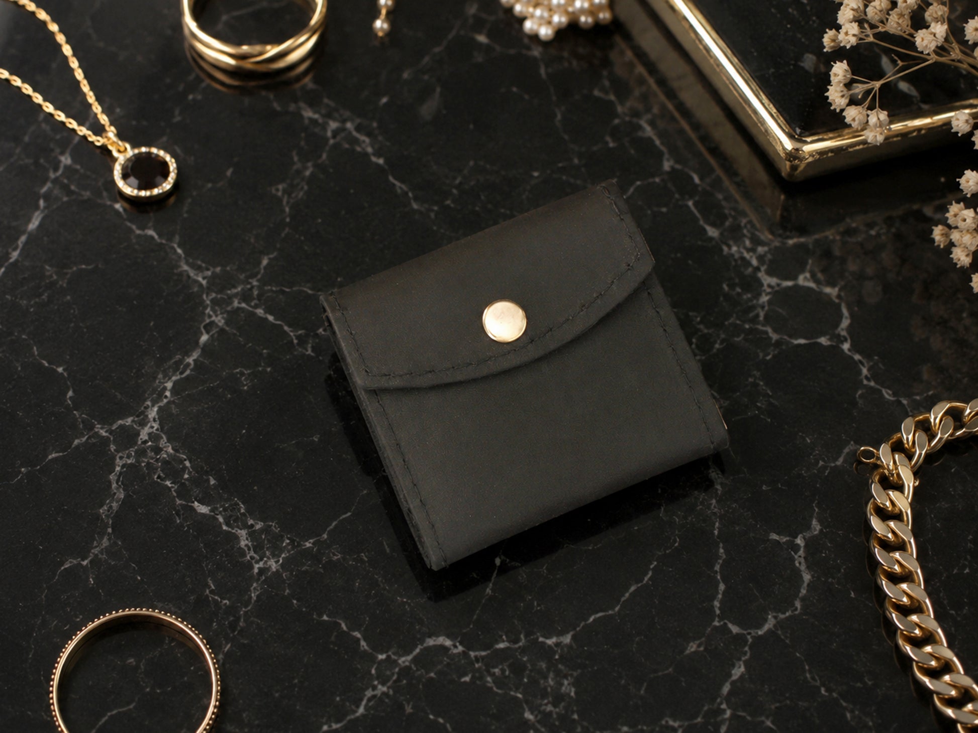 Leather jewelry pouch with adjustable strap, compact travel accessory