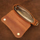 Interior of leather crossbody pouch, organized compartments for daily essentials