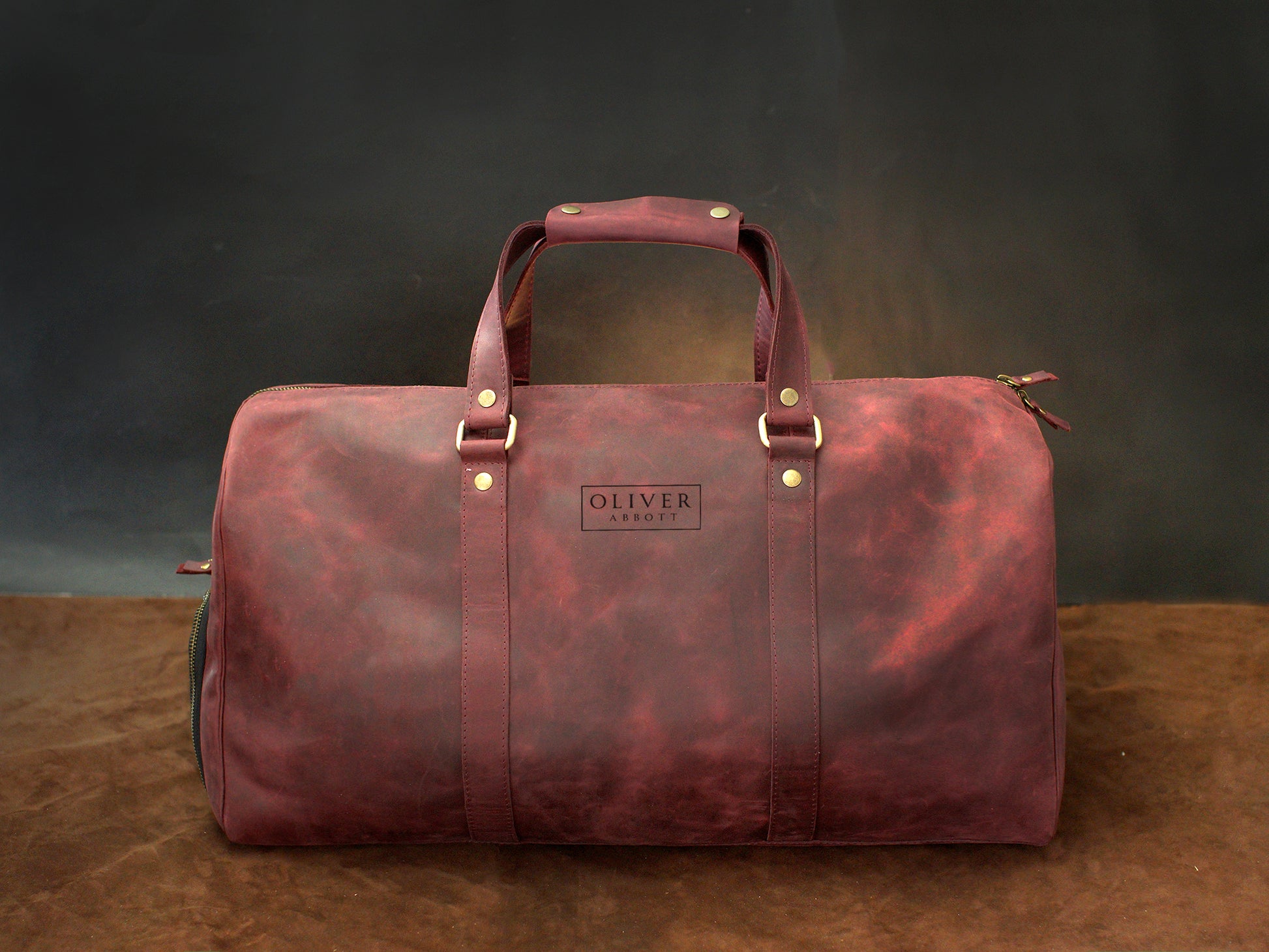 Leather duffle bag with custom stamp, handcrafted weekender design