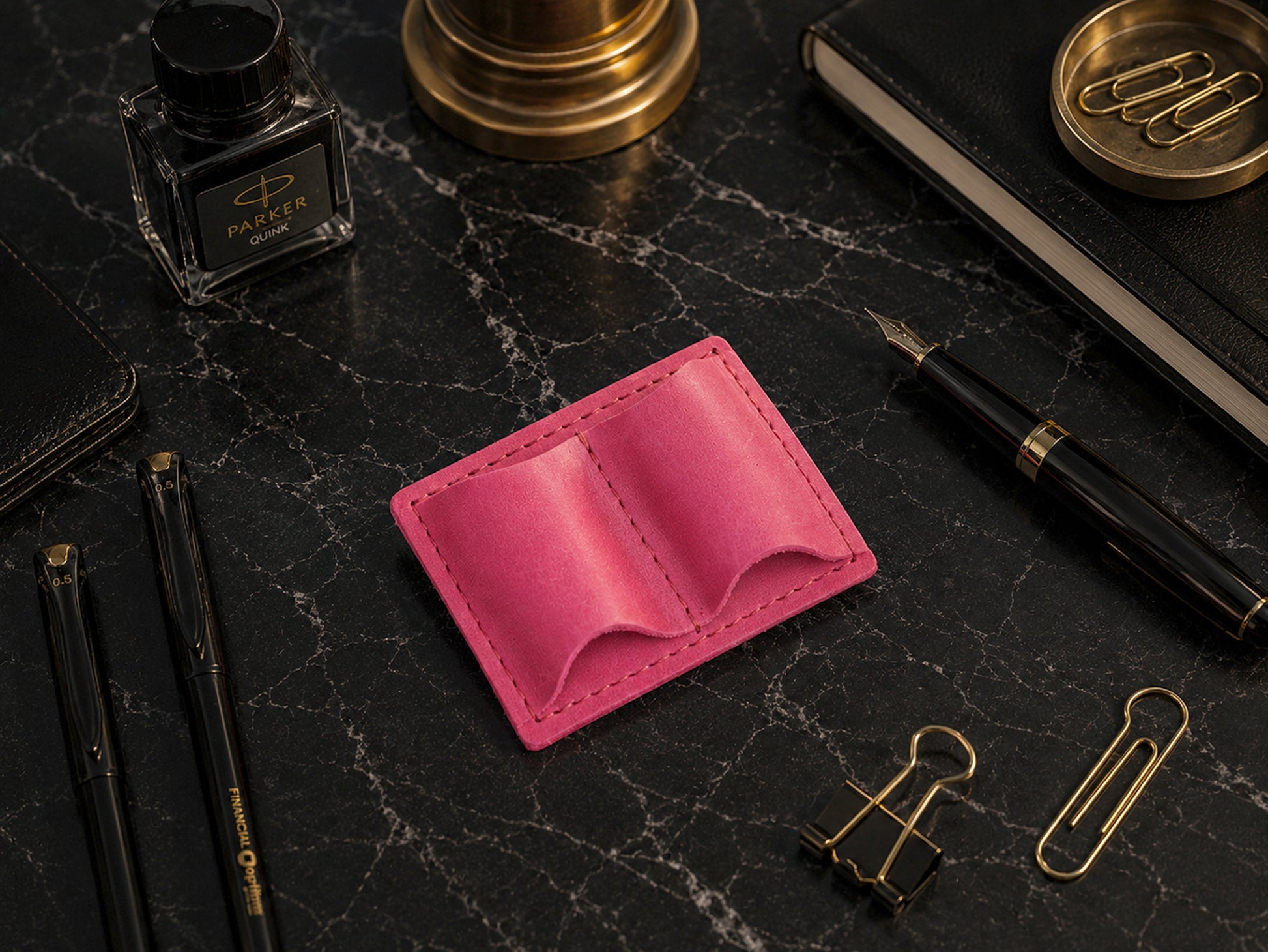 Leather pen loop strap and closure detail, durable brass hardware