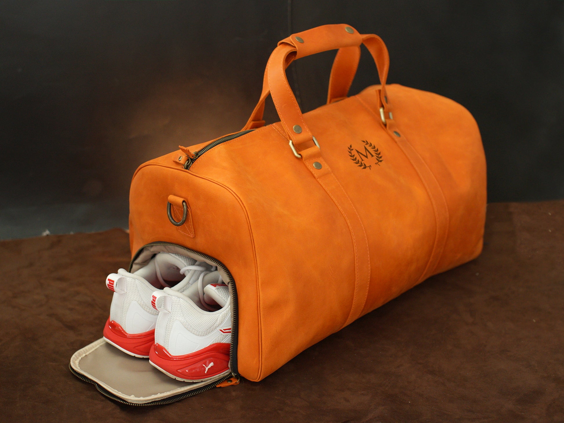Close-up of leather duffle bag zipper and hardware detail
