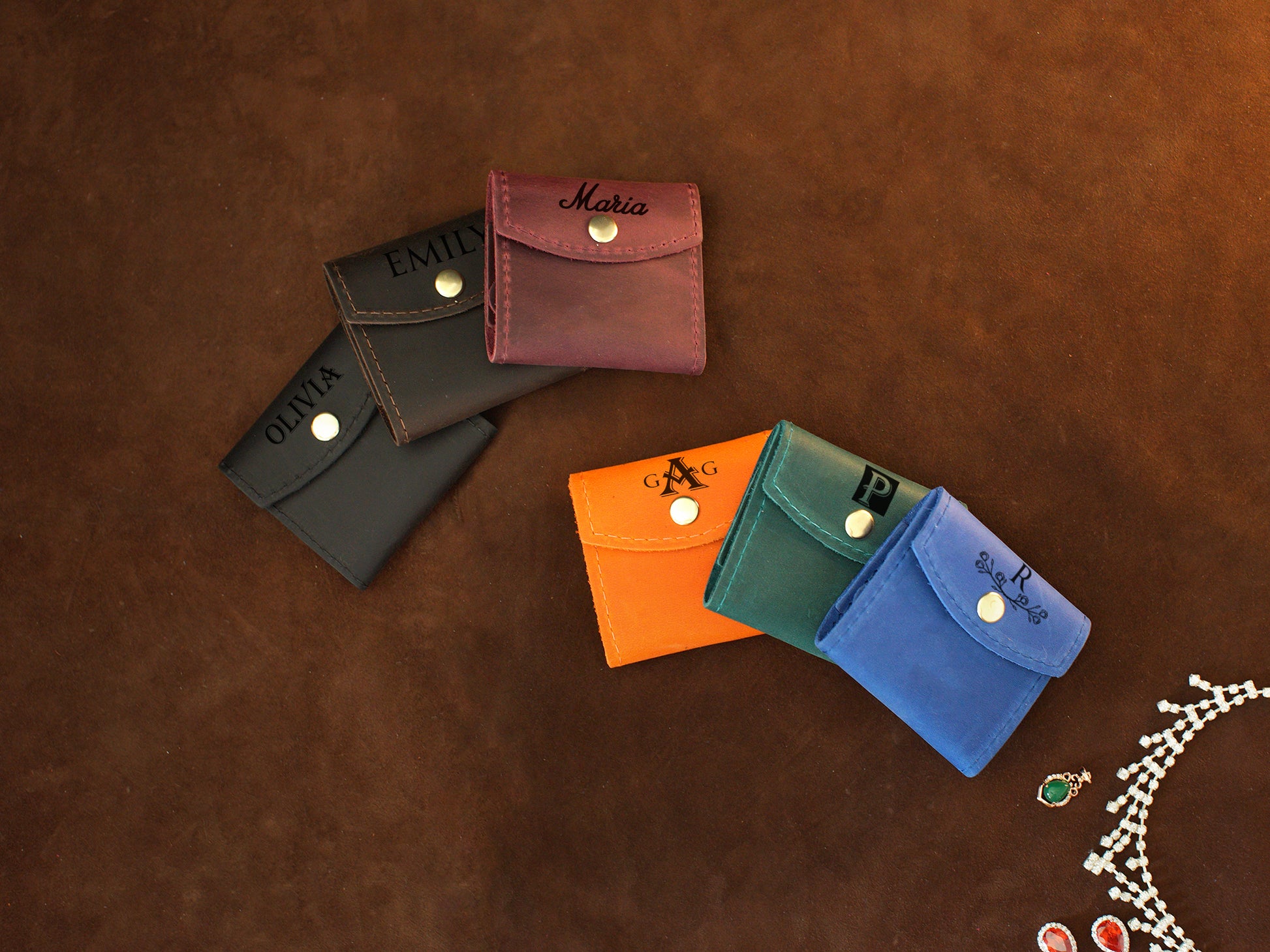 Personalized monogram engraving on handcrafted leather jewelry pouch