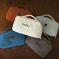 Personalized monogram embroidery on handcrafted sherpa toiletry bag