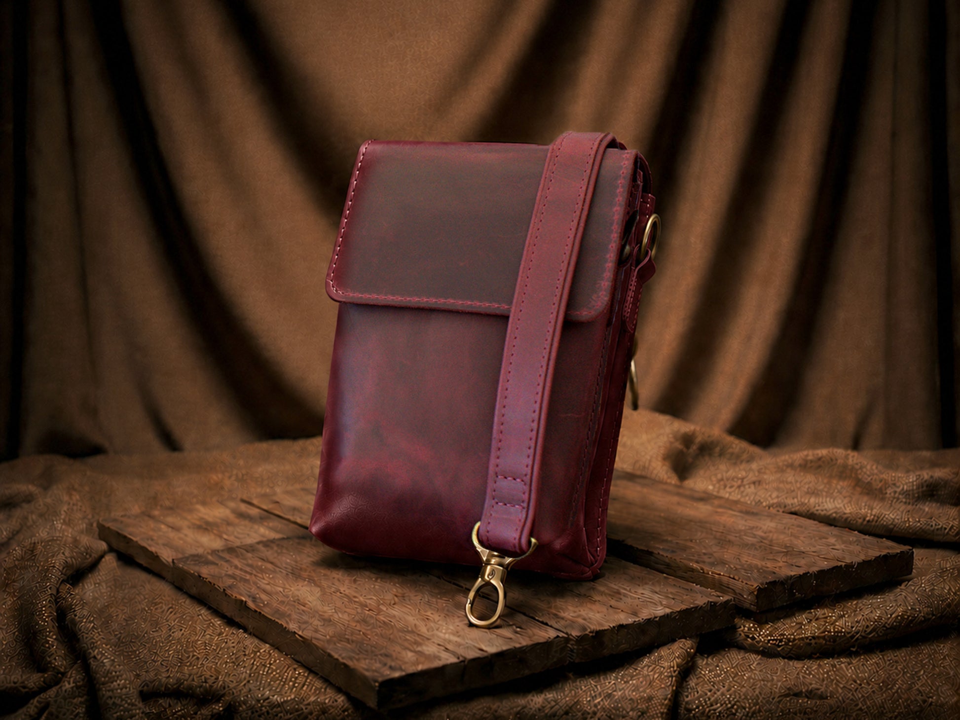 Leather messenger bag closure and hardware detail, durable brass finish