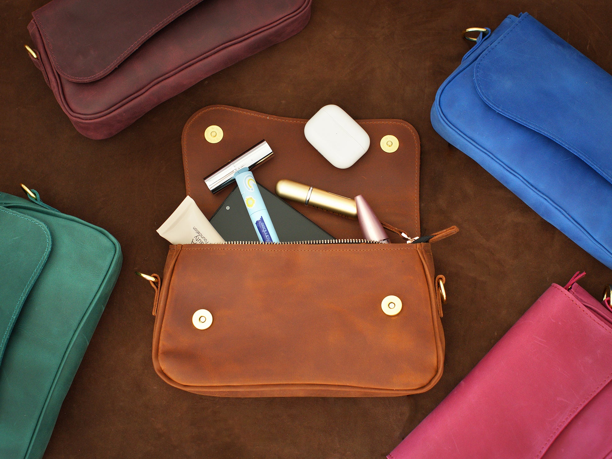 Natural leather crossbody pouch with warm patina, artisan craftsmanship