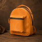 Orange backpack on a wooden surface with a brown background