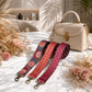 Beige handbag with floral and polka dot strap options on a marble surface with dried flowers.