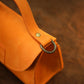 Interior of leather handbag, structured compartments for daily essentials