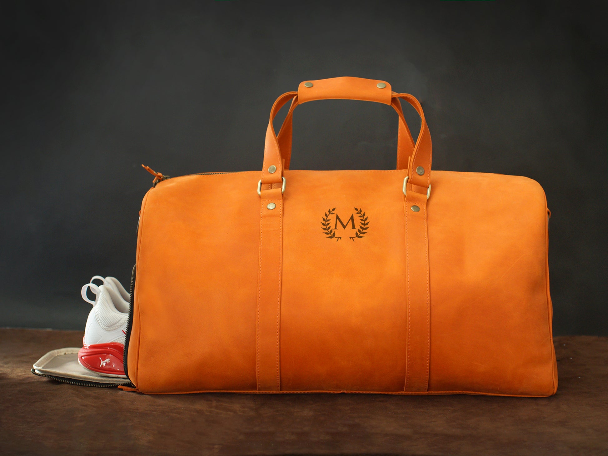 Personalized monogram engraving on handcrafted leather weekender bag