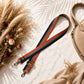 Strap with decorative elements on a textured surface