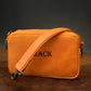 Premium leather crossbody bag with name stamp, warm earthy tone