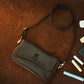 Person wearing personalized leather crossbody pouch, street style shot