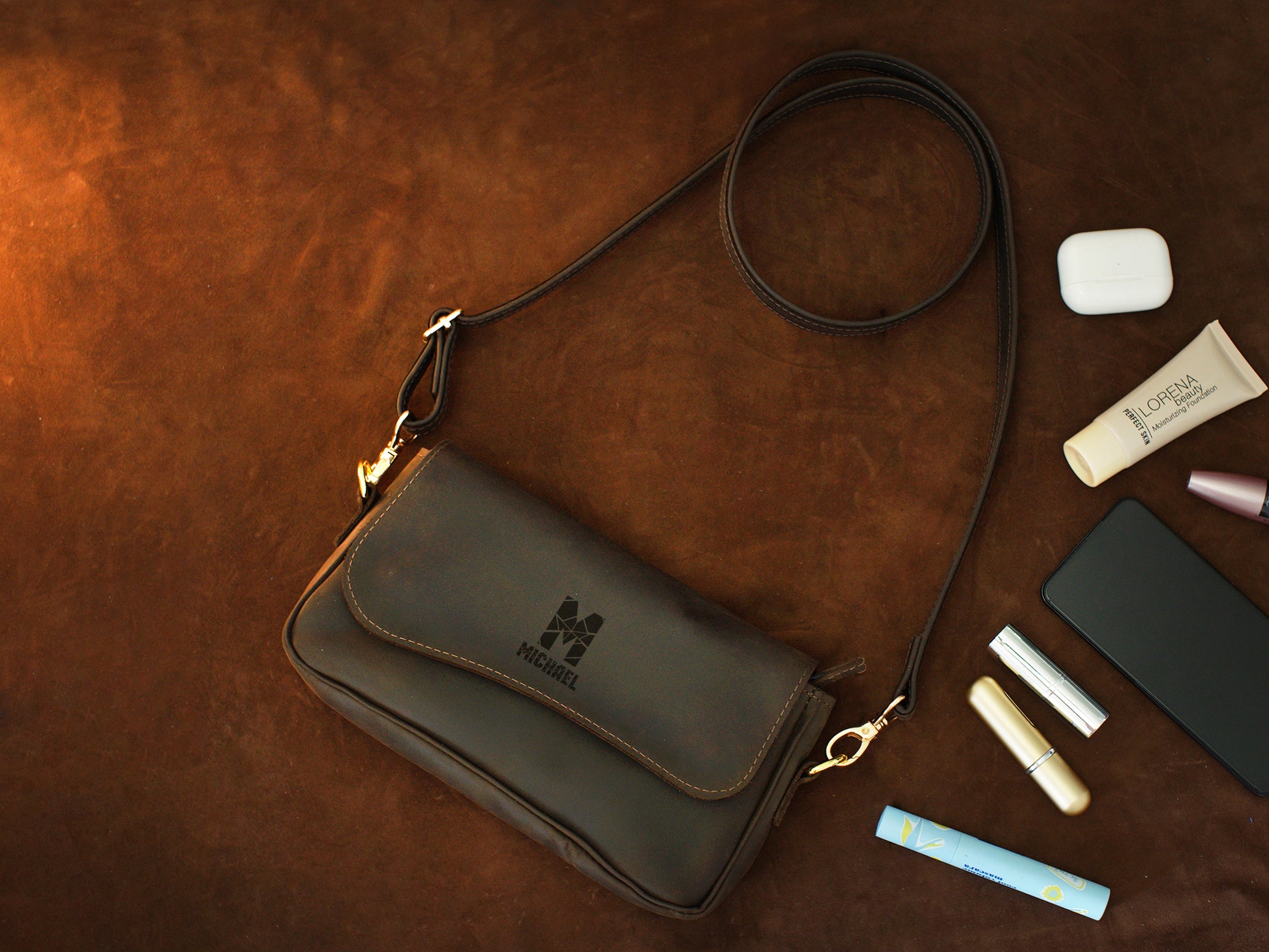 Person wearing personalized leather crossbody pouch, street style shot
