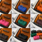 Collection of suitcases in various colors arranged in a grid inside a vehicle.