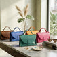 Leather handbag with custom monogram, structured crossbody design
