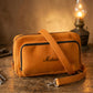 Natural leather crossbody bag with warm patina, artisan craftsmanship