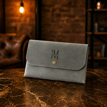 Premium leather clutch with name stamp, warm earthy tone