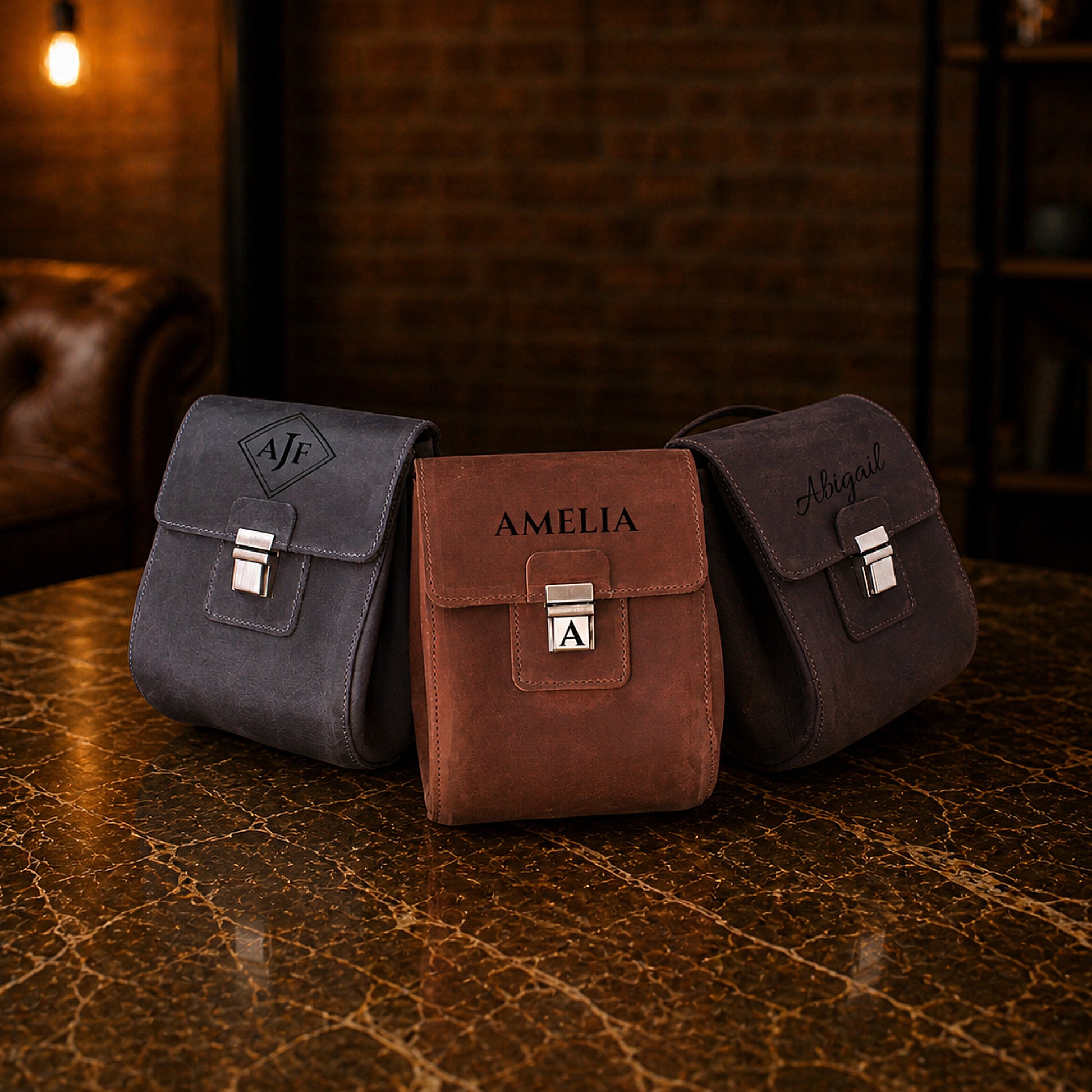 Leather dopp kit with clasp closure detail, durable brass hardware