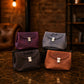 Person carrying personalized leather cosmetic bag, lifestyle editorial photo