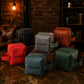 Collection of personalized toiletry bags on a rustic surface with a warm ambiance.