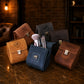 The Treasure Cube leather bag worn crossbody, warm earthy tones
