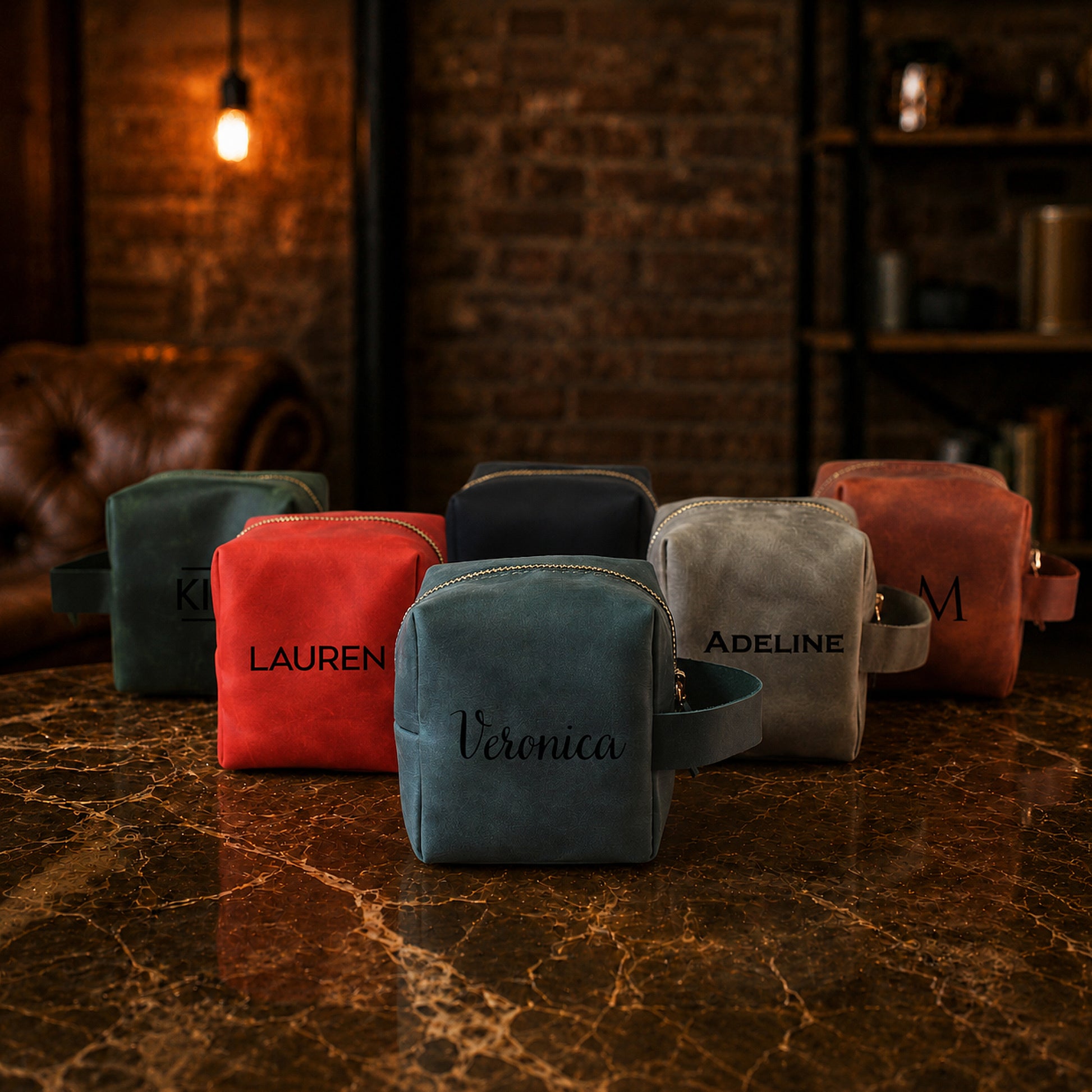 Set of personalized pouches on a marble surface with a warm, rustic background.