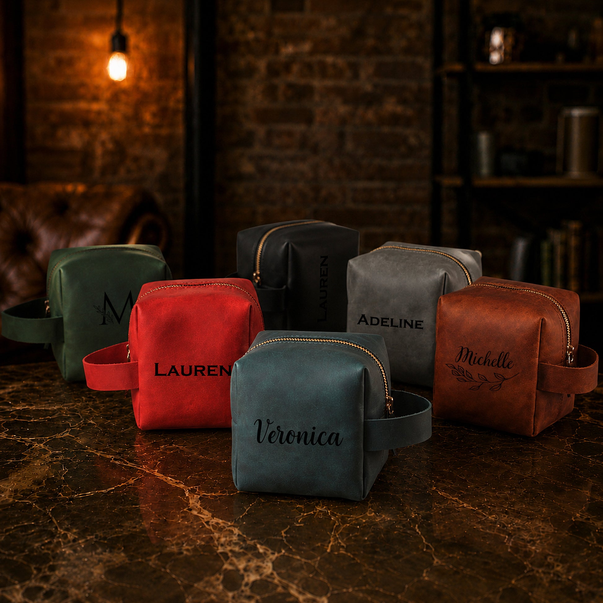 Collection of personalized leather bags on a marble surface with a rustic background.