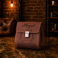 Brown leather dopp kit with custom monogram engraving, front view