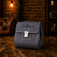 Minimalist leather cosmetic bag with clasp closure, handcrafted design