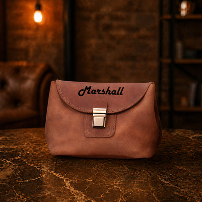 Minimalist leather cosmetic bag with structured design, handcrafted