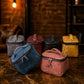 Person carrying personalized leather toiletry bag, lifestyle shot