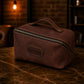 Natural leather cosmetic bag with warm patina, artisan detail