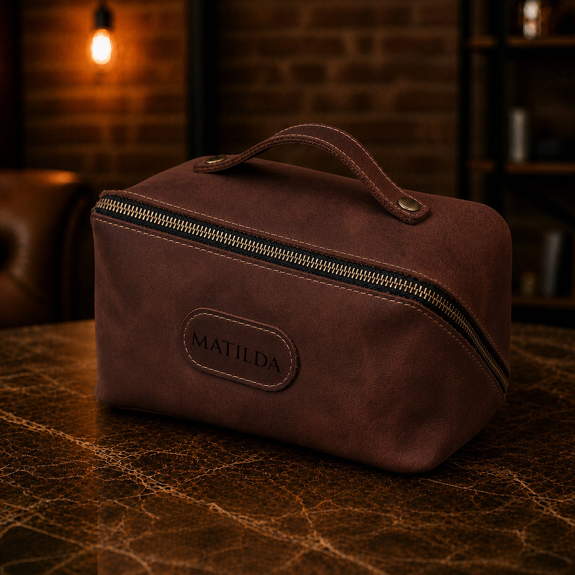 Natural leather cosmetic bag with warm patina, artisan detail