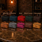 Multiple personalized leather vanity bags on textured surface