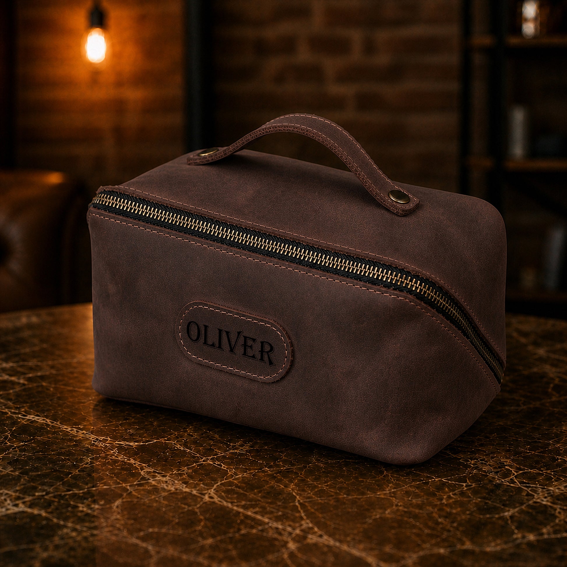 Leather cosmetic bag strap and closure detail, durable brass hardware