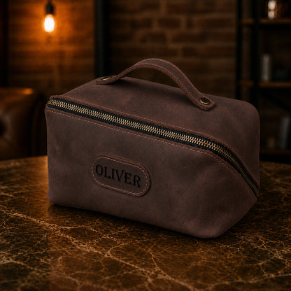 Leather cosmetic bag strap and closure detail, durable brass hardware