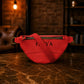 Brown leather fanny pack with custom monogram engraving, front view