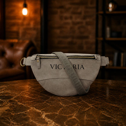 Minimalist leather fanny pack with dual strap system, handcrafted design