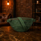 Interior compartment of leather fanny pack, organized pockets detail
