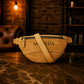 Leather fanny pack zipper and closure detail, durable brass hardware