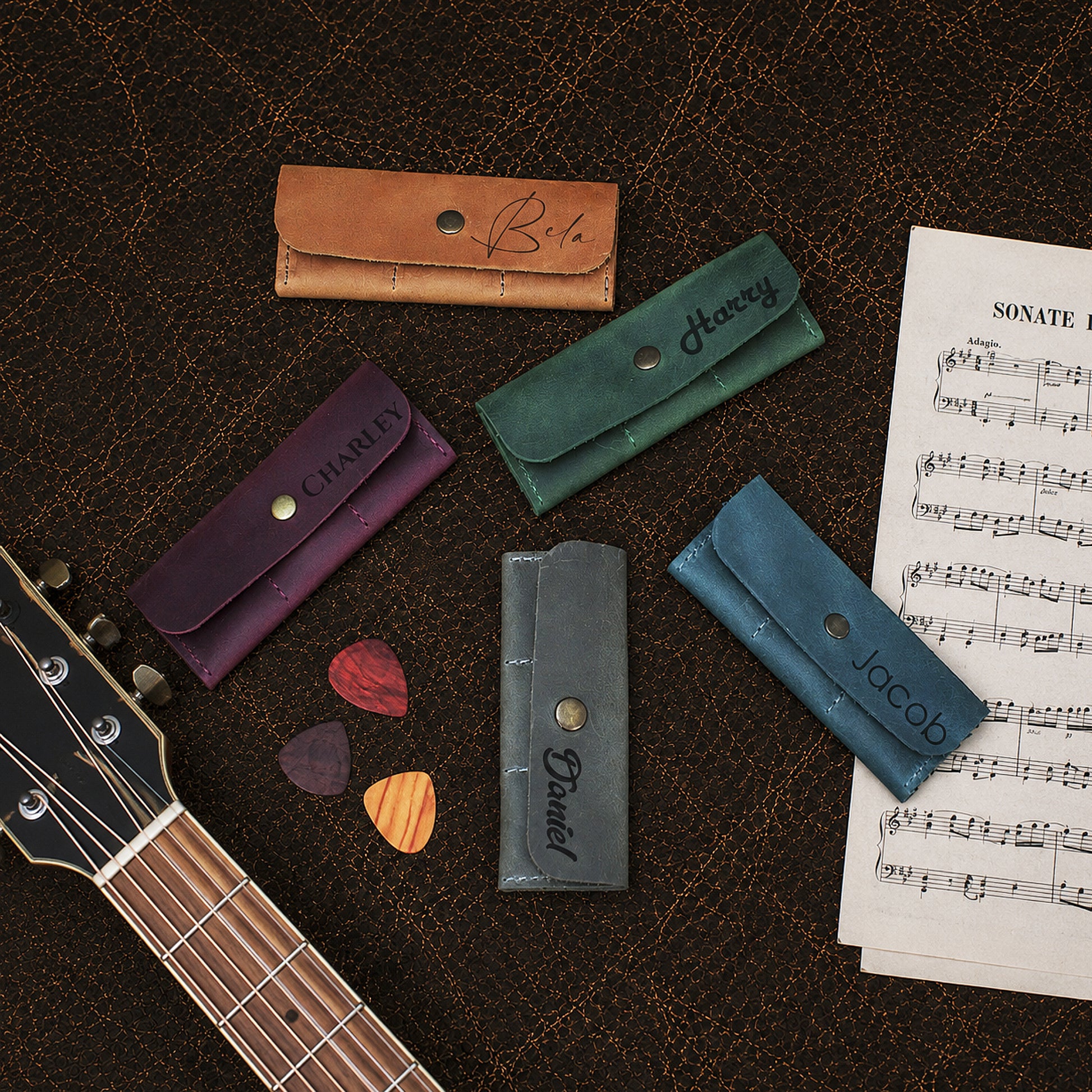 Natural leather guitar pick holder with warm patina, artisan craftsmanship