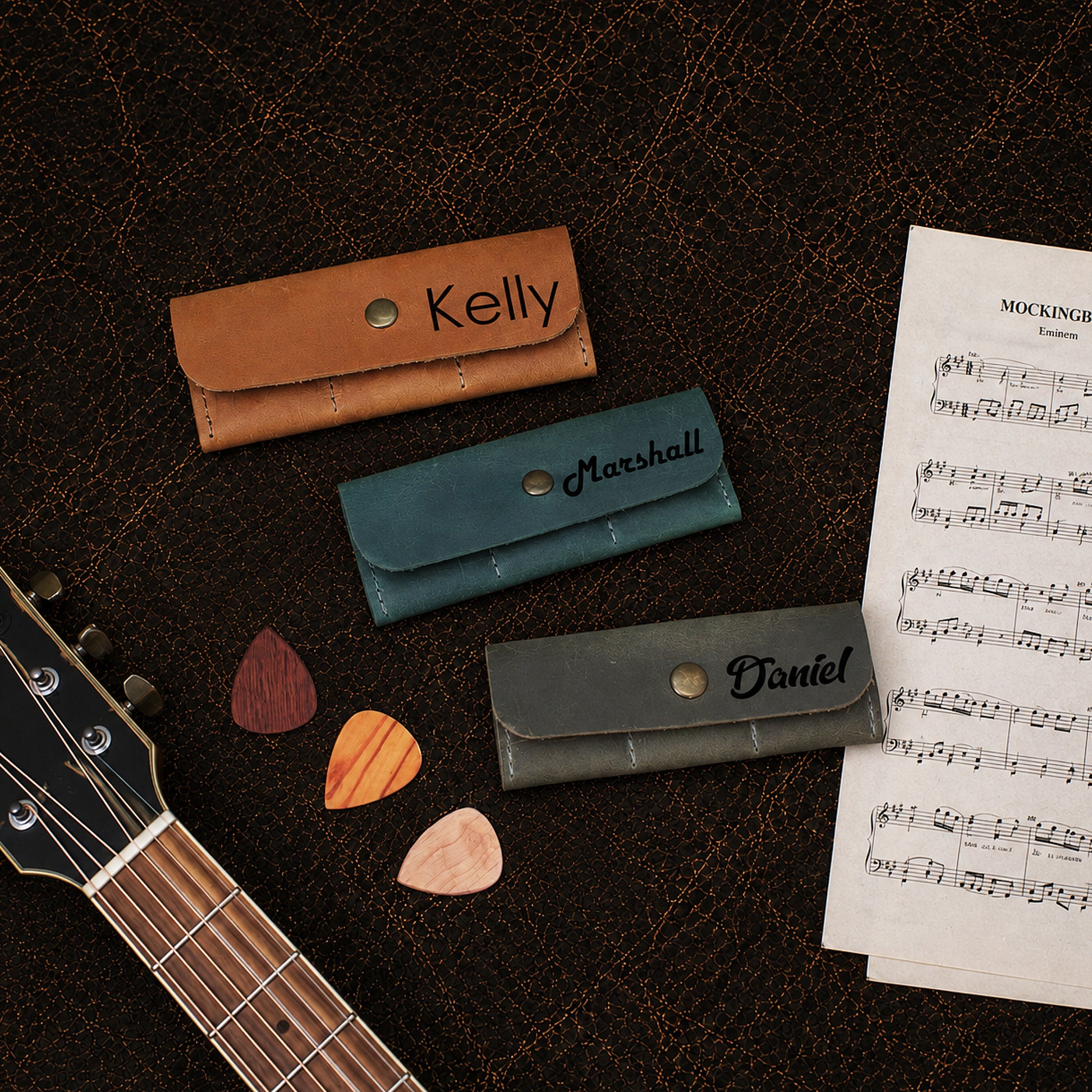 Leather pick pouch interior detail, organized storage for guitar picks