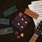 Person holding personalized leather guitar pick holder, lifestyle photo