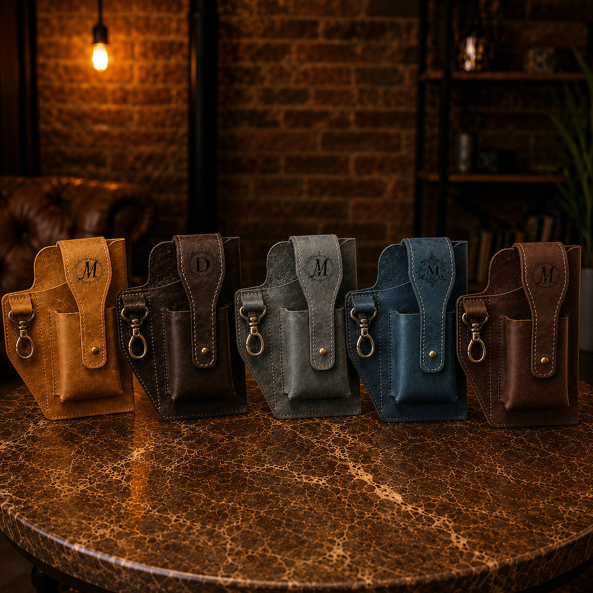 Five leather pouches in various colors arranged on a textured surface with a warm-toned background.