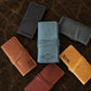 Minimalist leather cable pouch with roll-up design, handcrafted